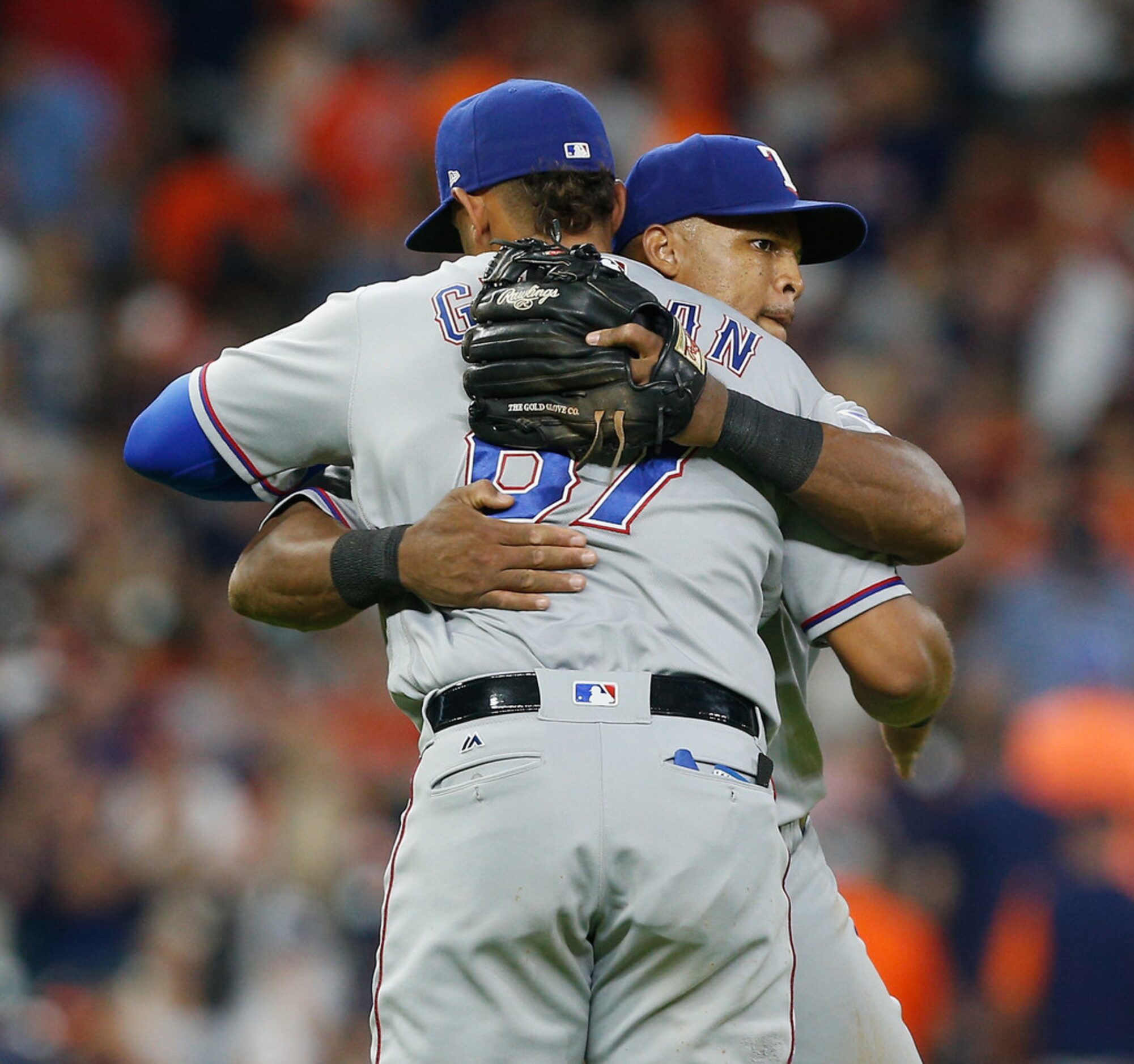 HOUSTON, TX - JULY 28:  Adrian Beltre #29 of the Texas Rangers hugs Ronald Guzman #67 after...