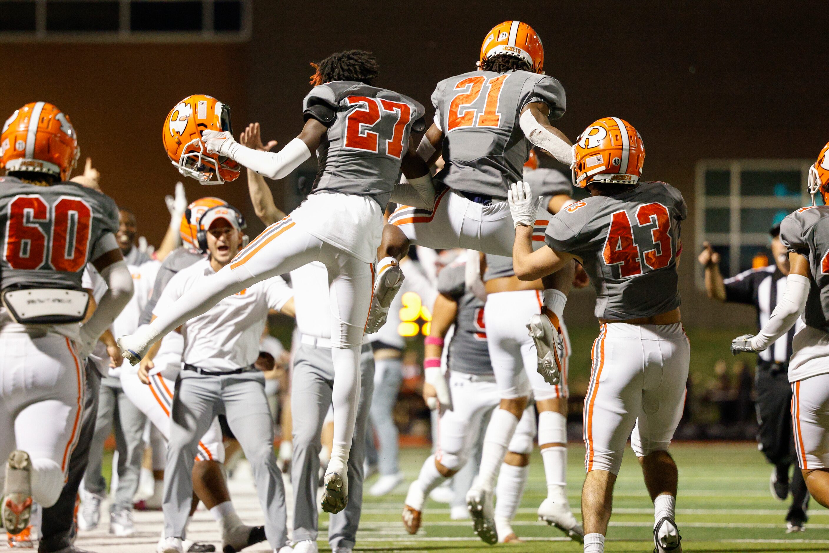 Rockwall running back Jamir Wilson (21) celebrates his touchdown with cornerback Eric...