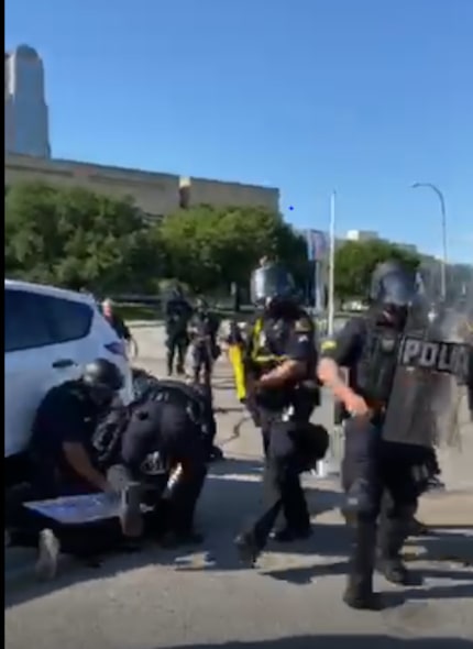 Moments after Dallas police officers tackled Lily Godinez, they pressed her to the ground to...