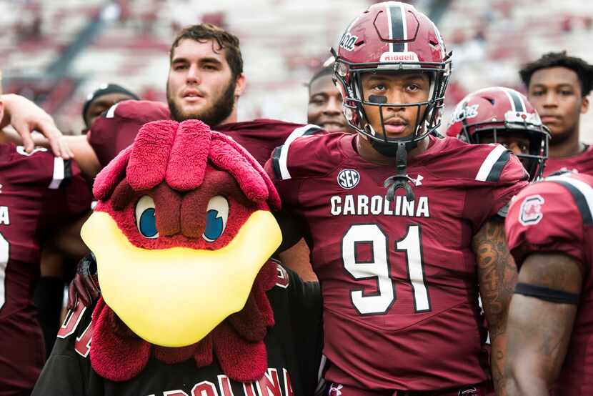 FILE - South Carolina defensive lineman Shameik Blackshear (91) stands with Cocky during the...