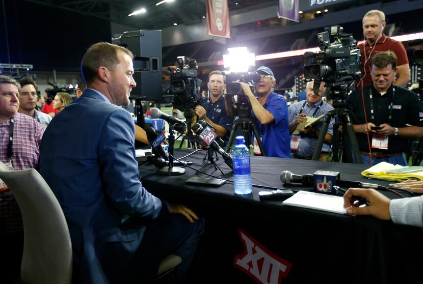 Oklahoma head football coach Lincoln Riley talks with the media during a breakout session in...