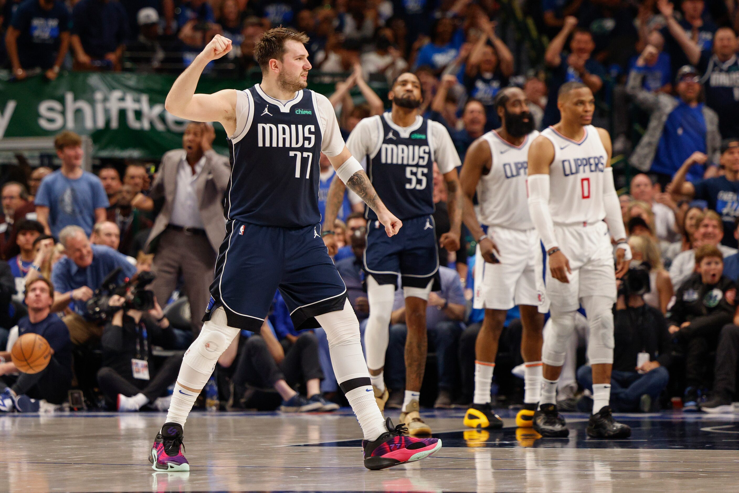 Dallas Mavericks guard Luka Doncic (77) reacts after a basket during the first half of Game...