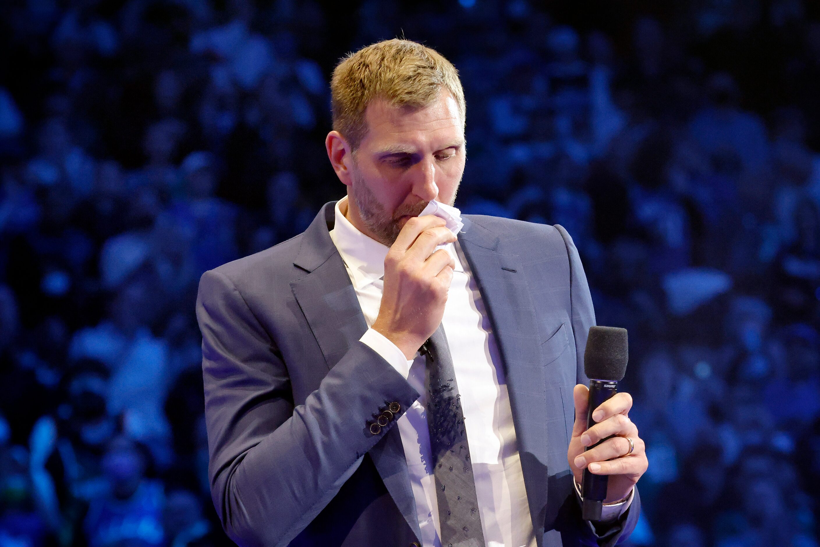 Former Dallas Mavericks All-Star Dirk Nowitzki and his family watch as his jersey is lifted...