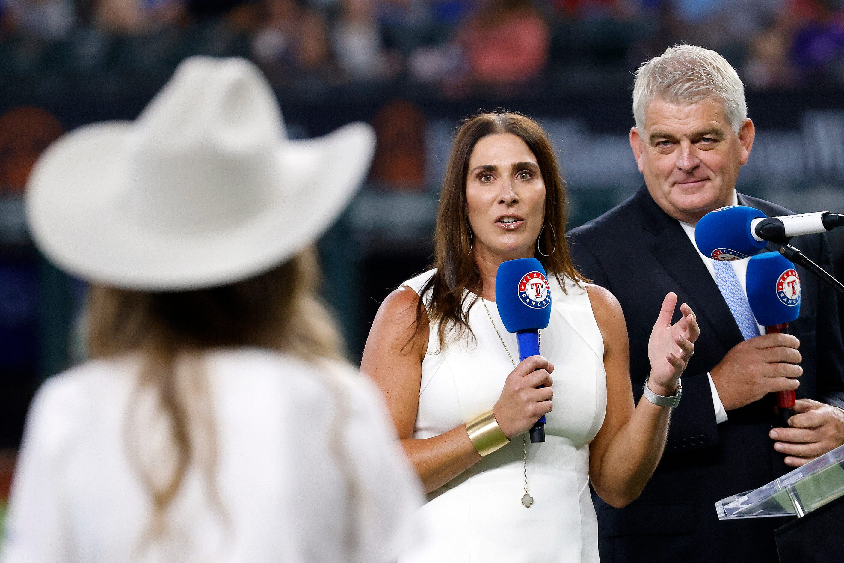 Bally Sports Southwest sports reporters Emily Jones (center) and John Rhadigan (right)...