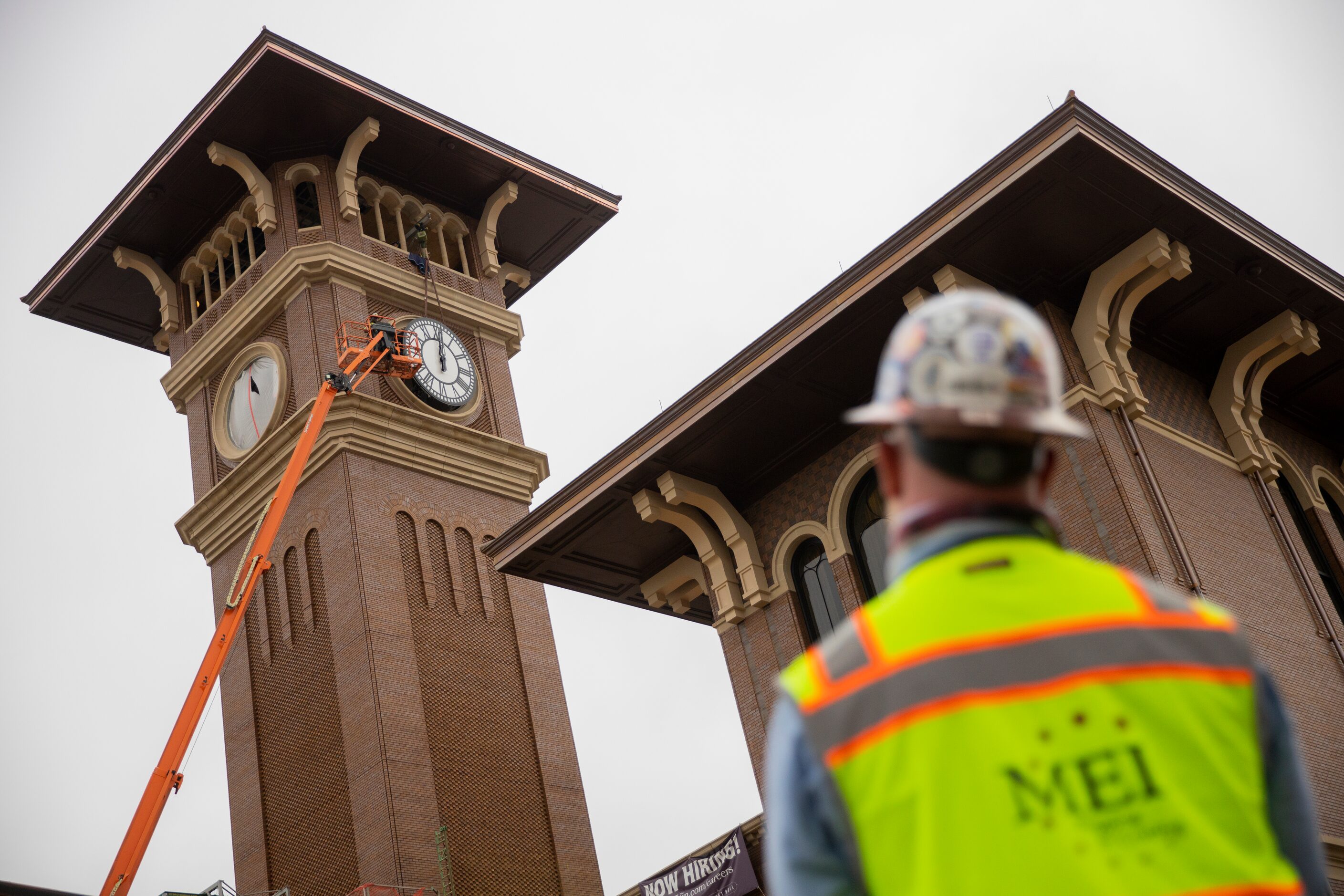 Clint Hoffman, operations manager with MEI Rigging & Crating, watches as his crew works to...