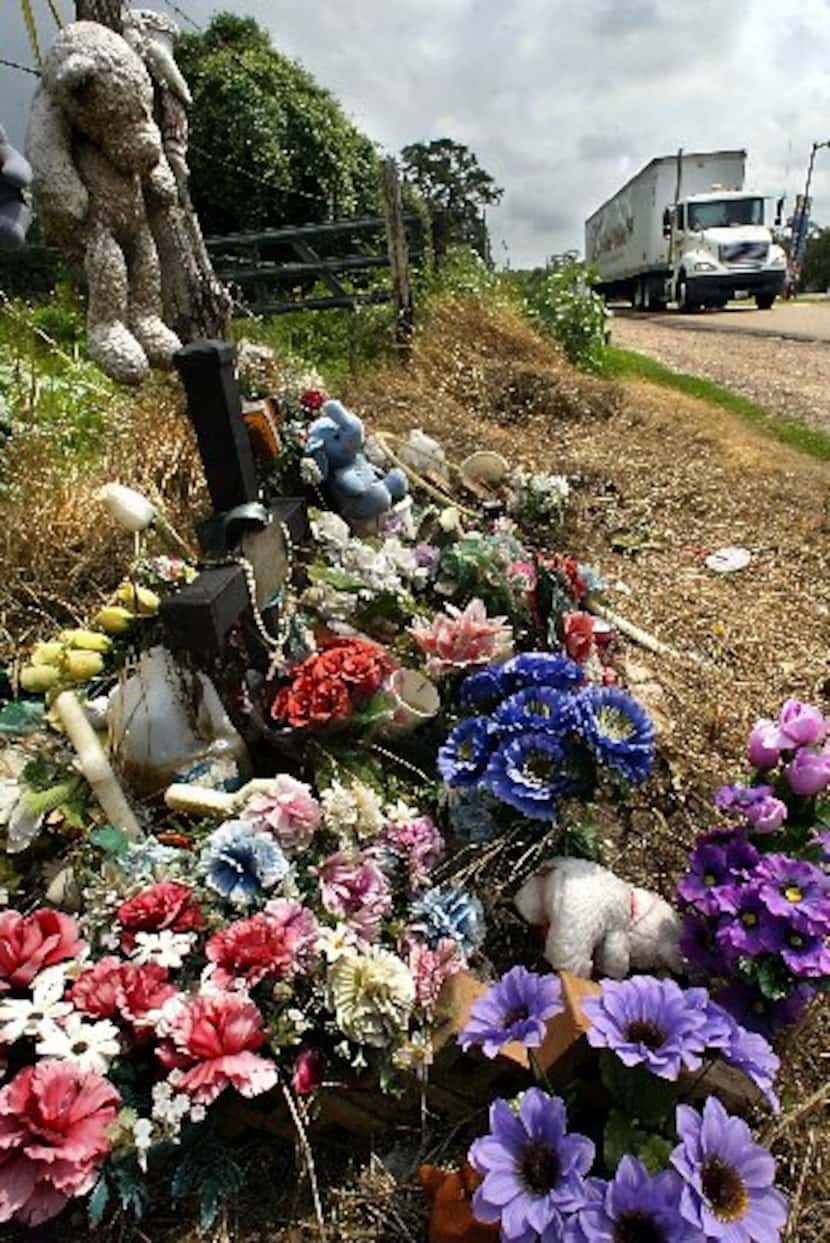 Flowers, teddy bears, water and rosary beads are among the items left in 2004 at the site...