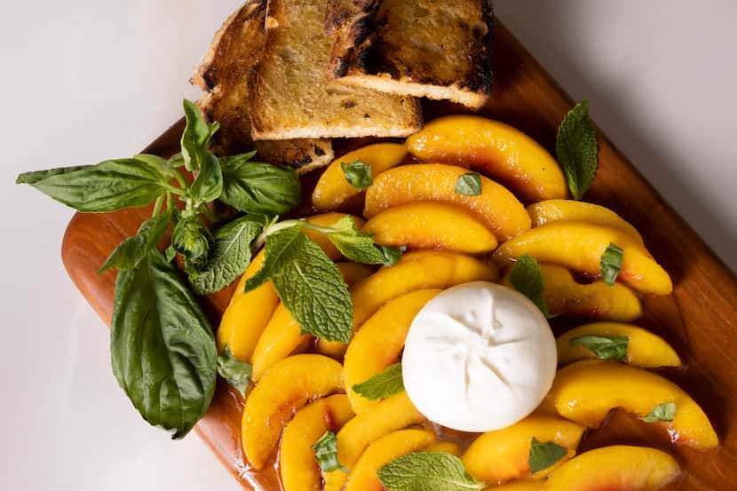 Peaches with Burrata and Hot Honey can be smeared on slices of toasted artisan bread. Serve...