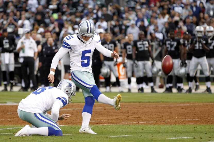 Dallas Cowboys kicker Dan Bailey (5) successfully kicks a field goal in a game against the...