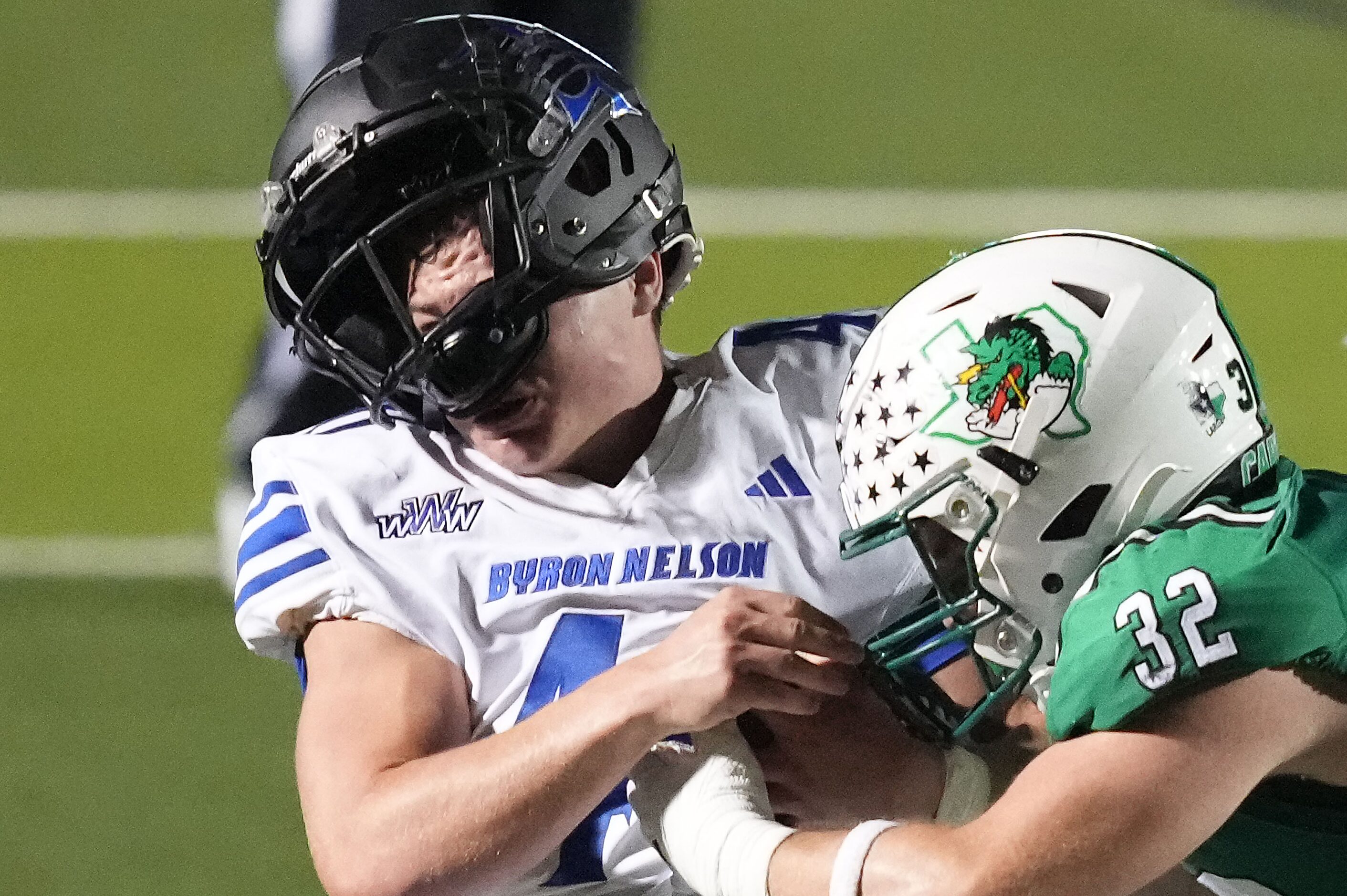 Trophy Club Byron Nelson running back Anthony Sexton (40) is brought down by Southlake...