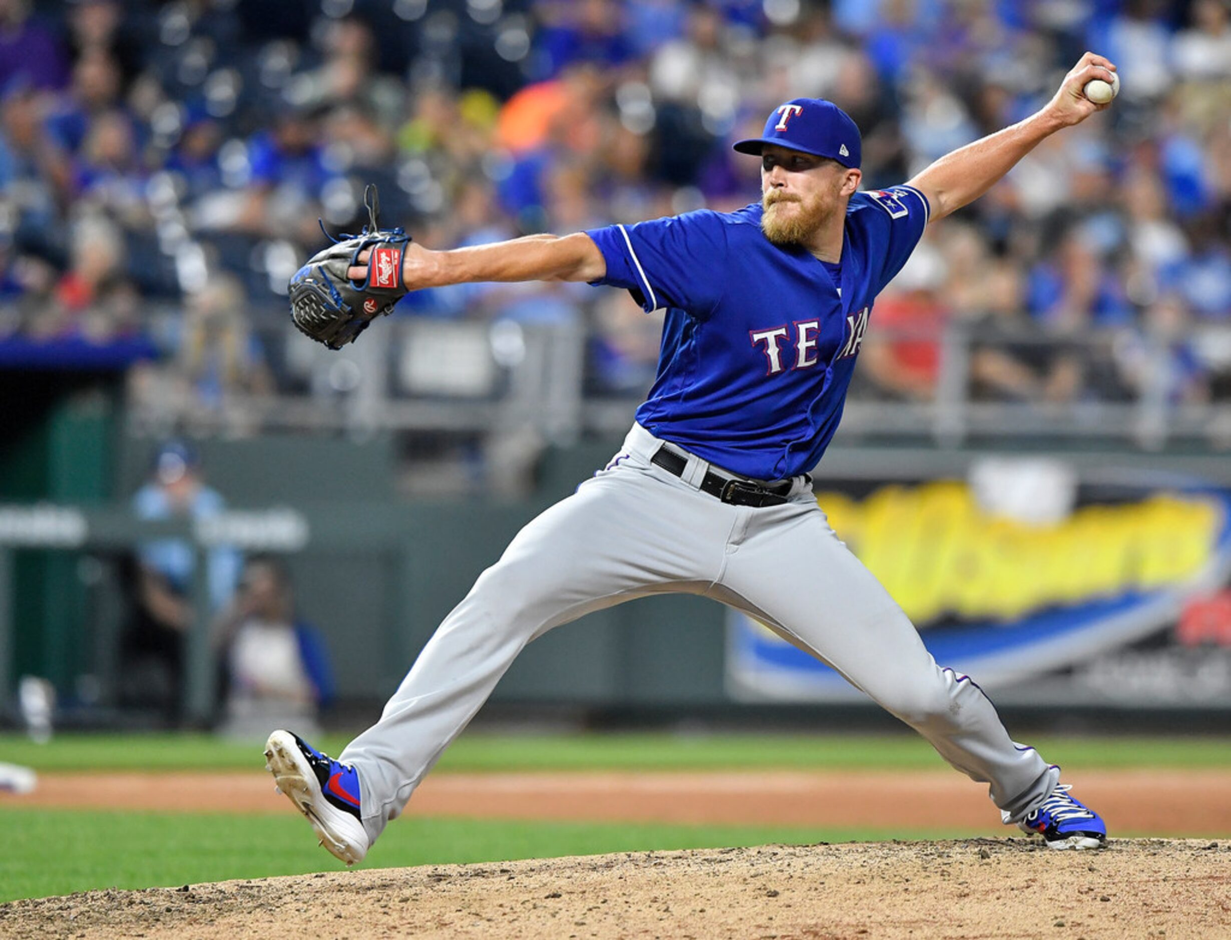 Texas Rangers relief pitcher Jake Diekman throws in the eighth inning against the Kansas...