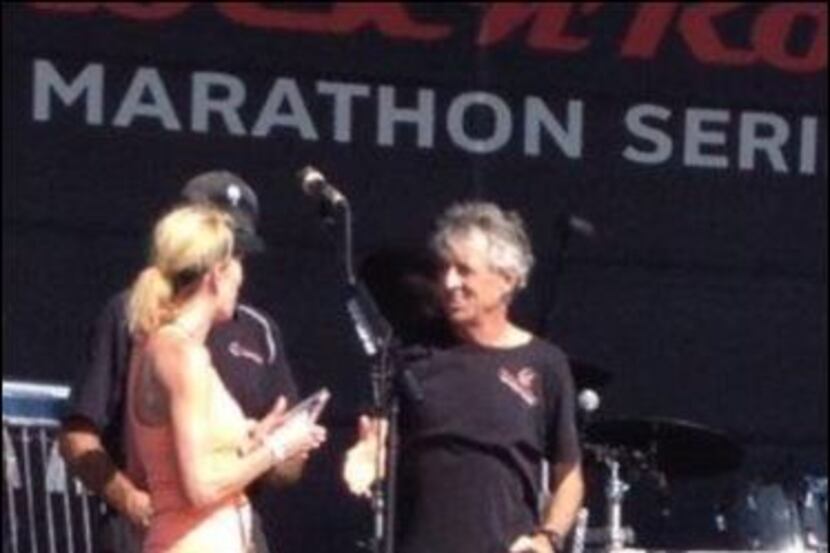 Debbie Clark receiving her Rock 'n' Roll Half Marathon Grand Prix age group title from Frank...