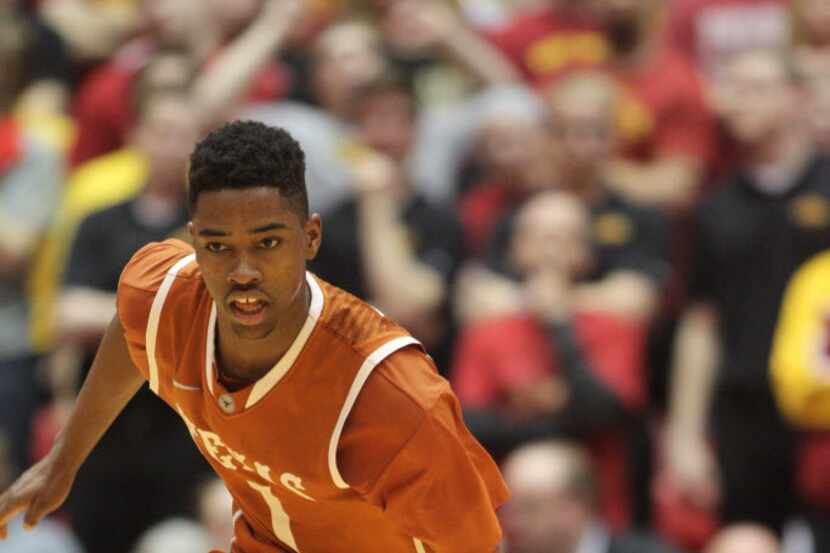 Texas guard Isaiah Taylor brings the ball up court during the second half of an NCAA college...