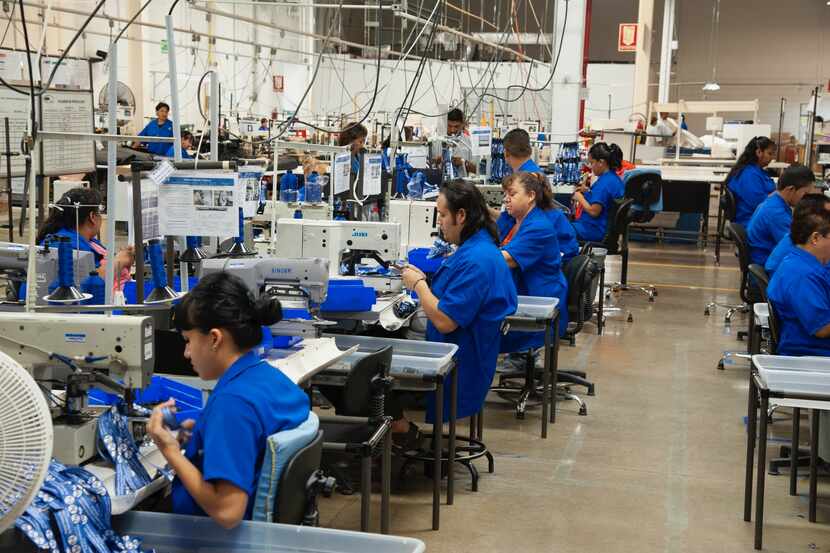 Workers inside an MFI International plant in Ciudad Juarez, Mexico, make fabrics in February...