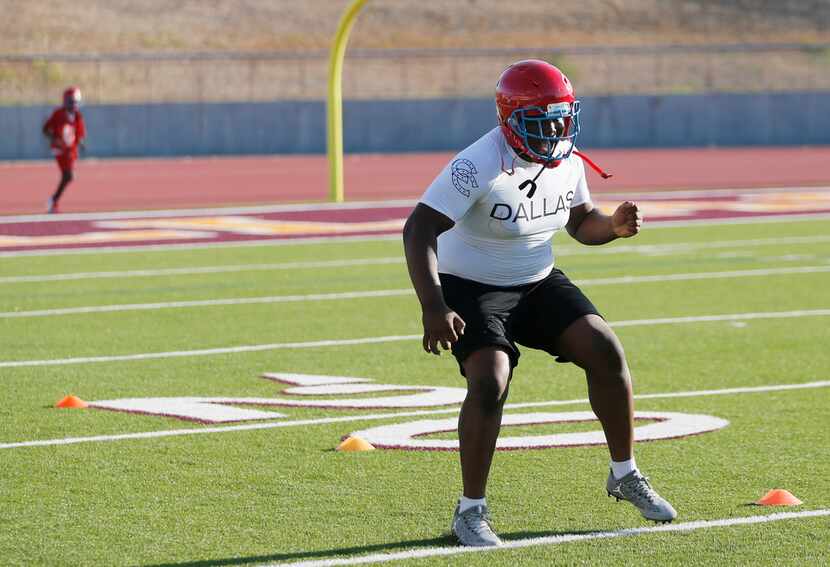 Carter's Branard Wright runs through a drill during the first day of football practice for...