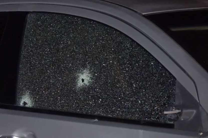Dallas police said two rounds were fired into the passenger-side front door of a car in...