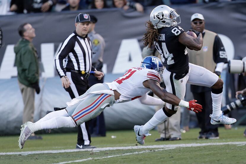 Oakland Raiders wide receiver Cordarrelle Patterson (84) tries to run by New York Giants...