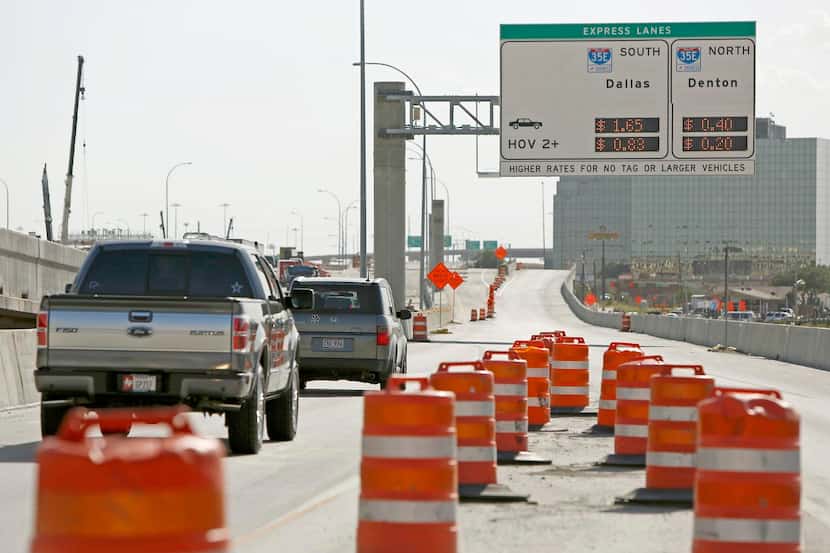 
New signs on LBJ Freeway alert motorists to the soon-to-open toll connection with...