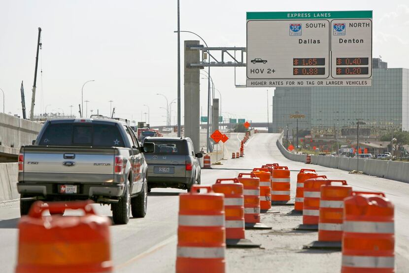 
New signs on LBJ Freeway alert motorists to the soon-to-open toll connection with...