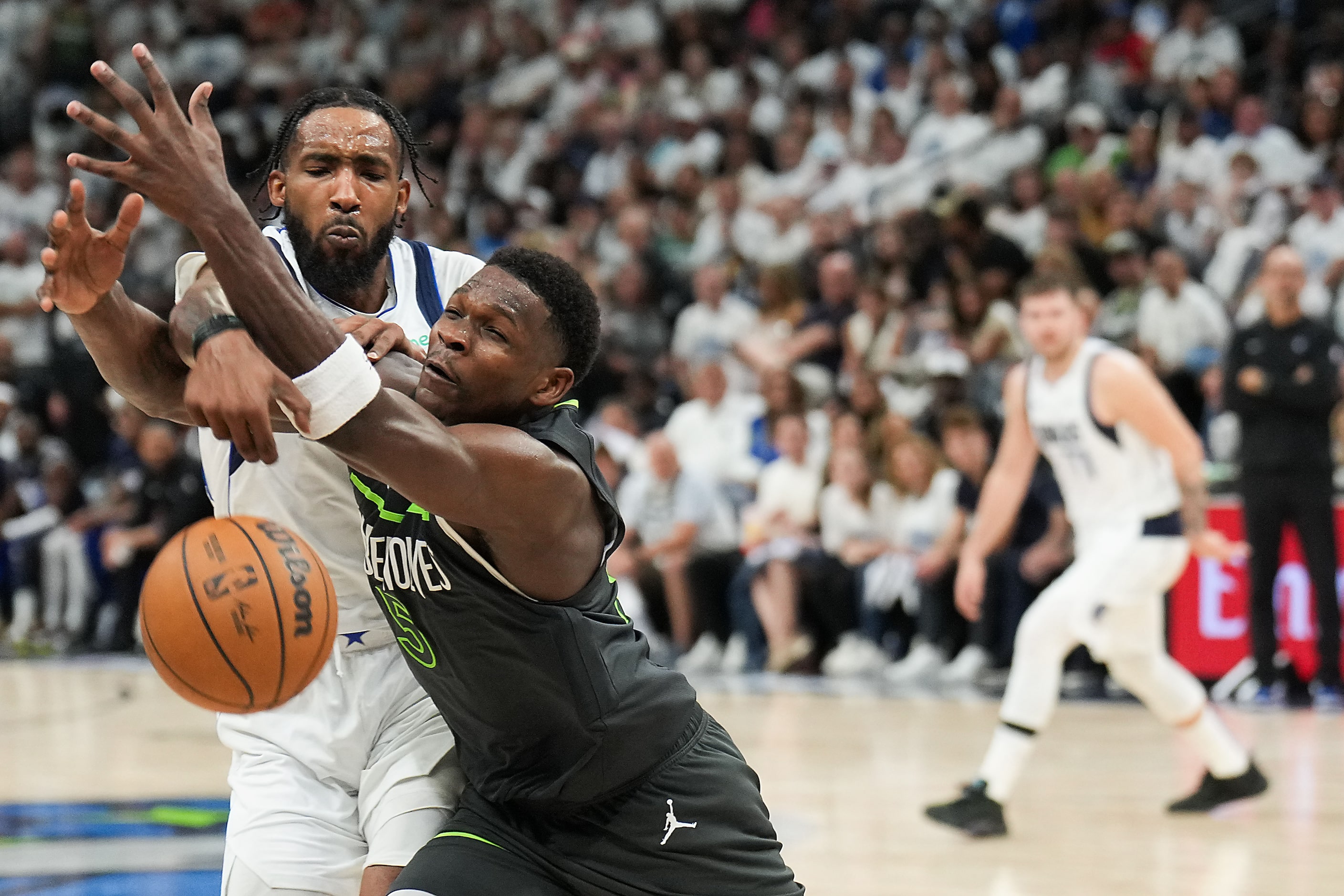 Dallas Mavericks forward Derrick Jones Jr. (55) knocks the ball away from Minnesota...