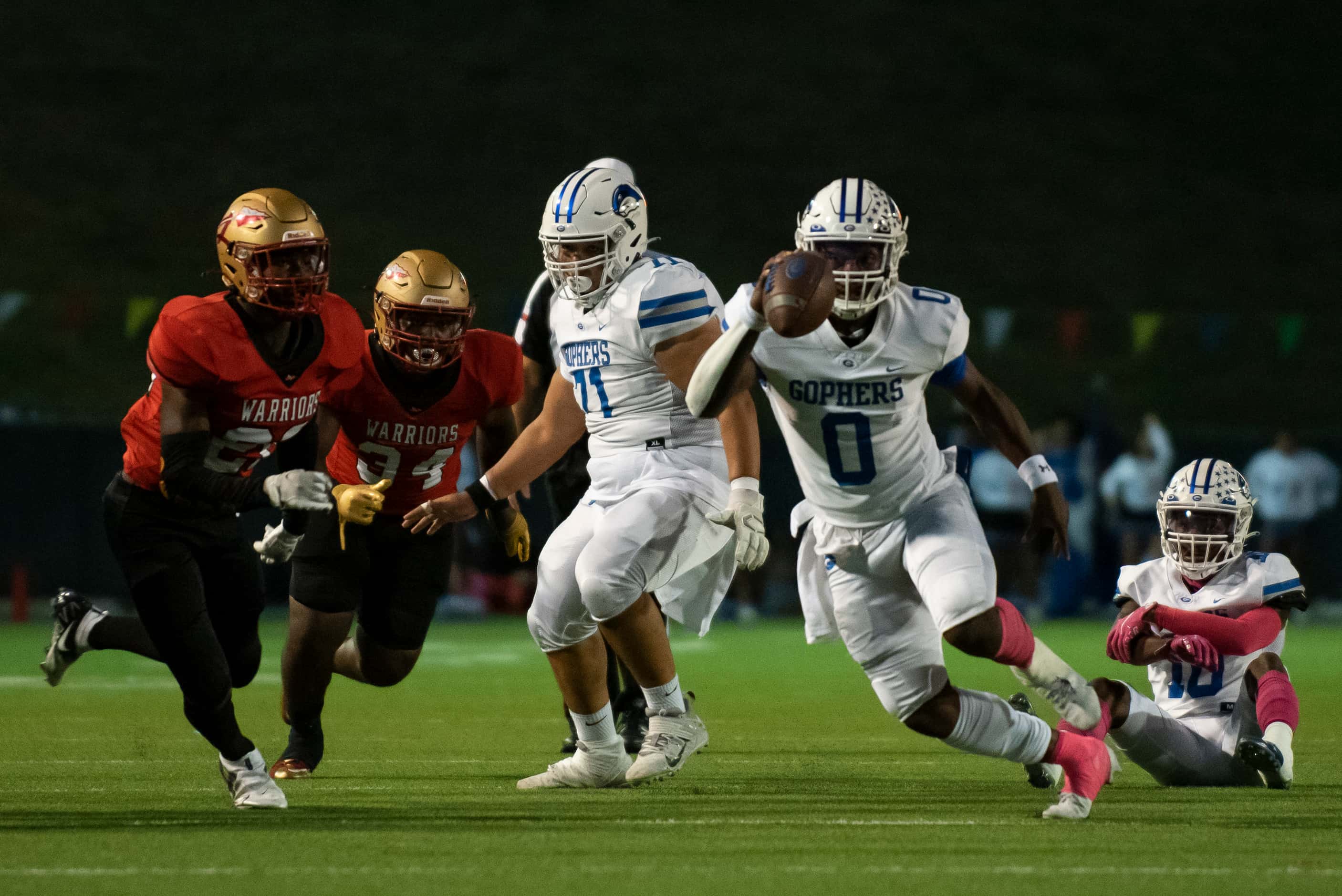 Grand Prairie senior Savion Red (0) rushes up the middle to gain yardage during South Grand...
