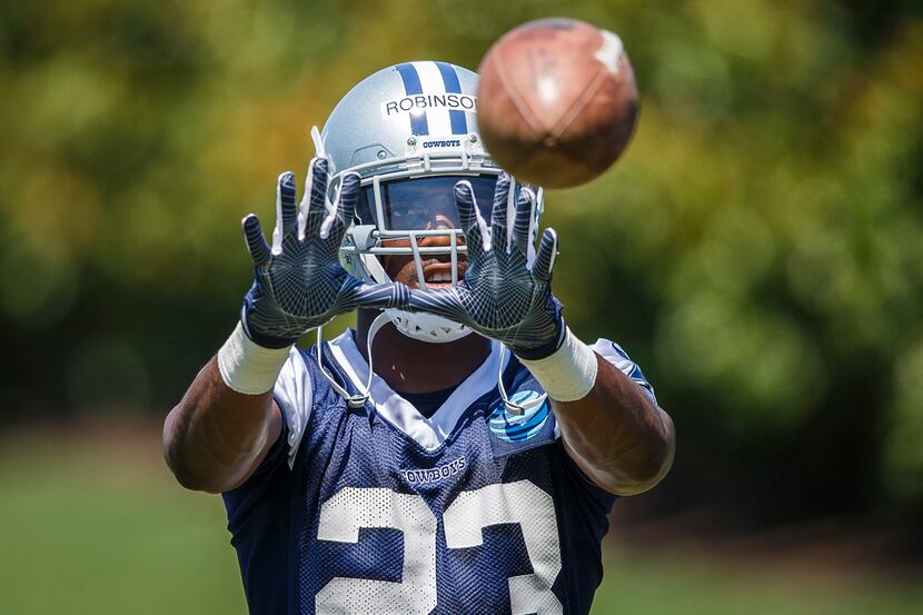 Cowboys defensive back Tyree Robinson (23) catches a ball during the third and final round...