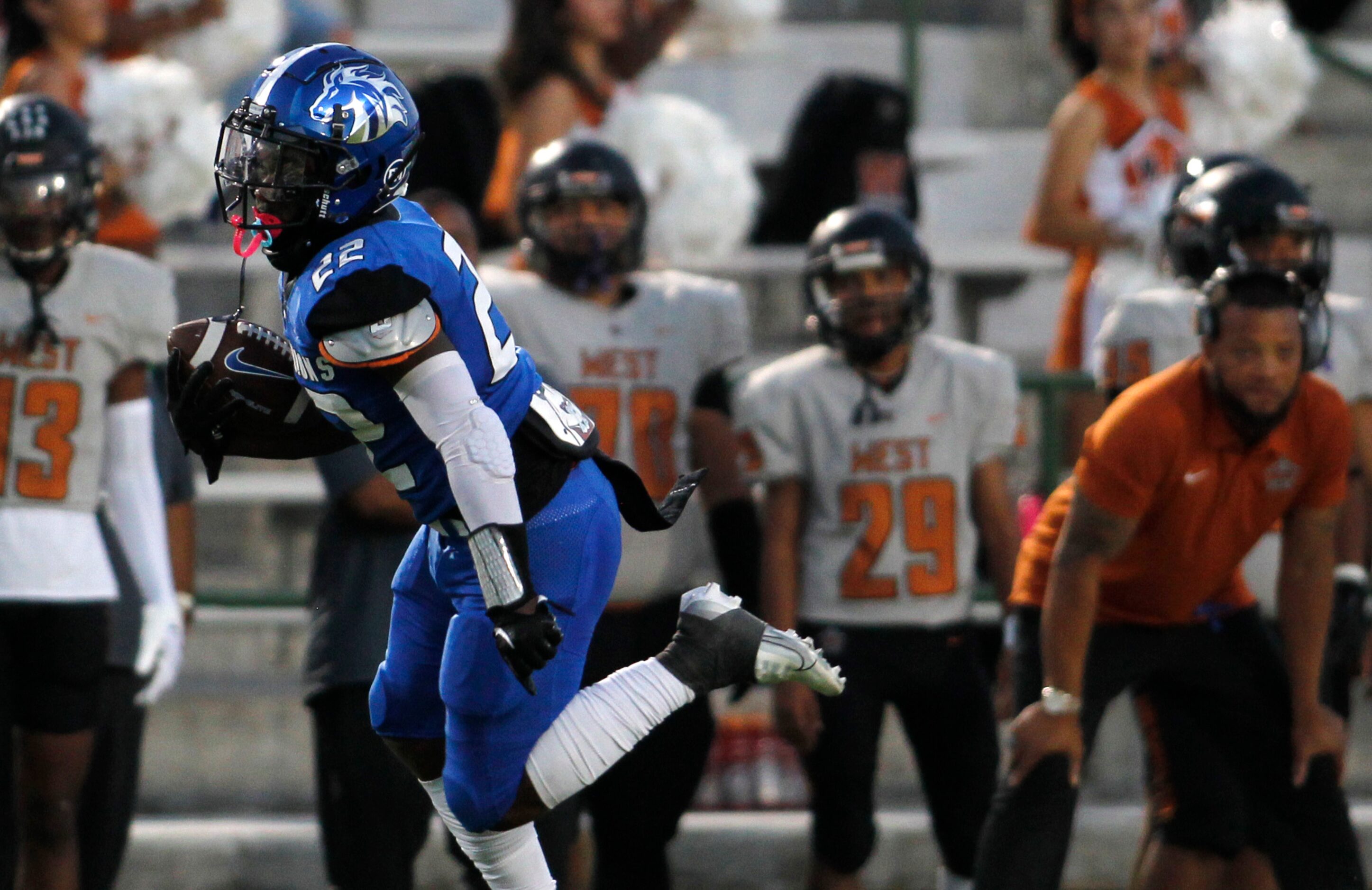 North Mesquite's Ka'Majay Else (22) tacks on yardage after a reception during first quarter...