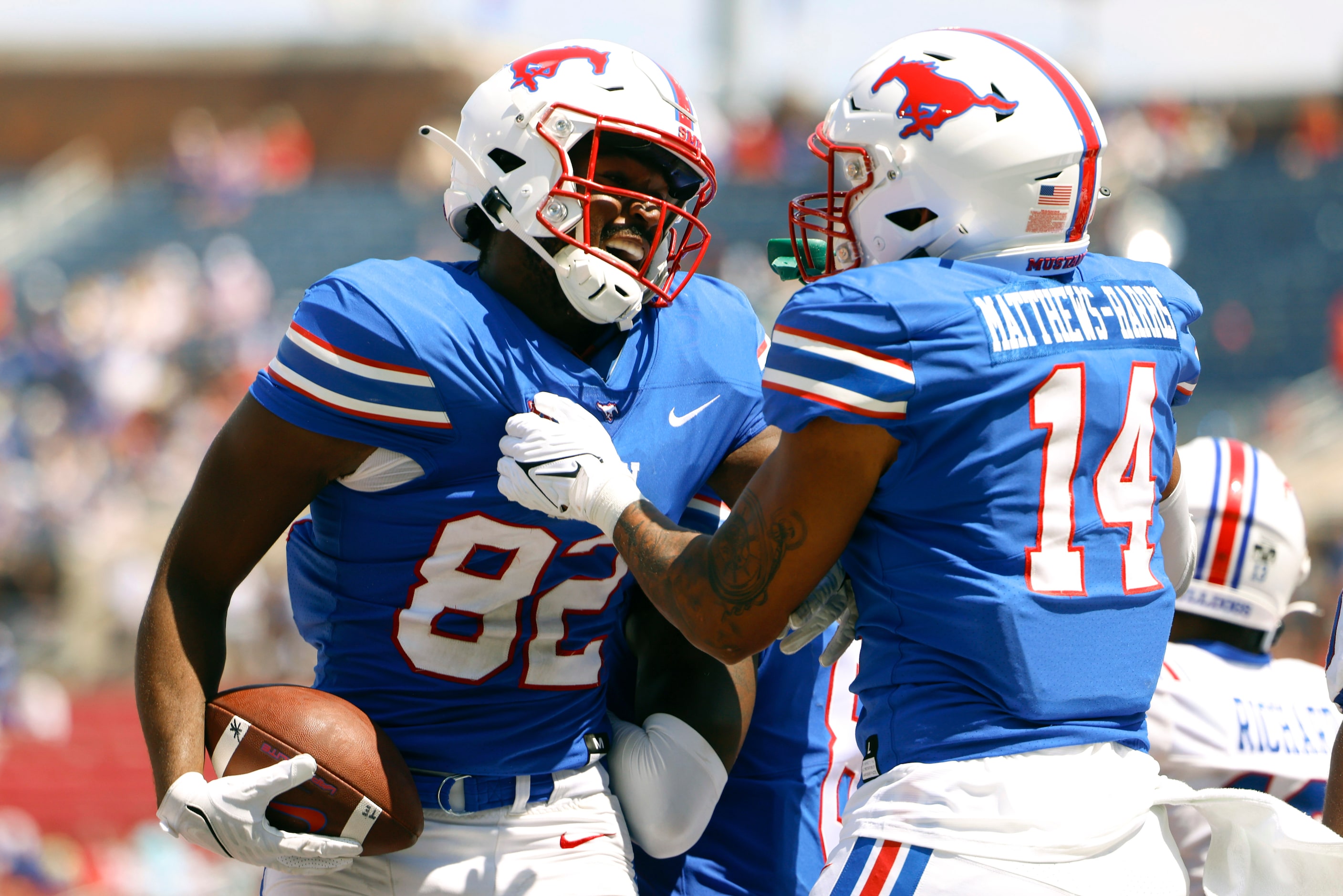 Southern Methodist tight end RJ Maryland (82) and tight end Nolan Matthews-Harris cheer...