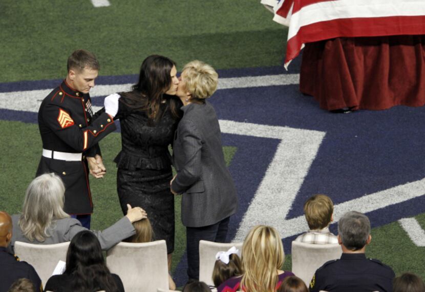 Taya Kyle returns to her seat after speaking about her husband Chris Kyle during a memorial...