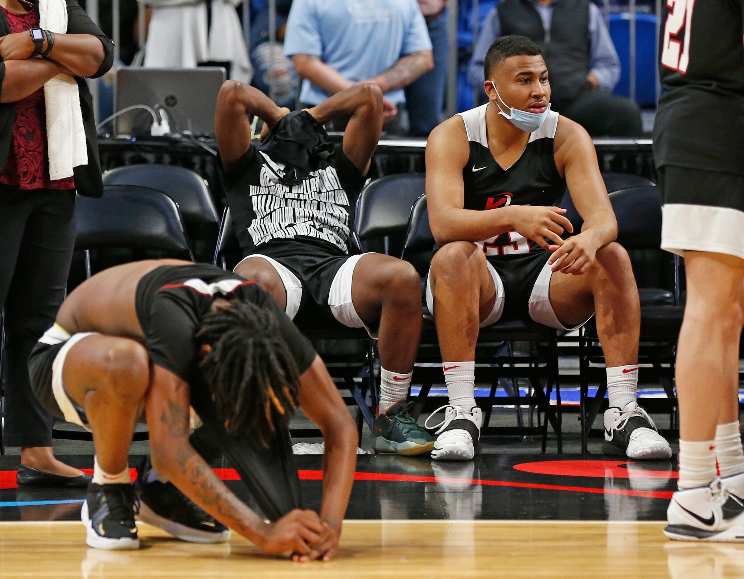 Kimbal players react after losing in OT to Beaumont. UIL boys Class 5A basketball state...