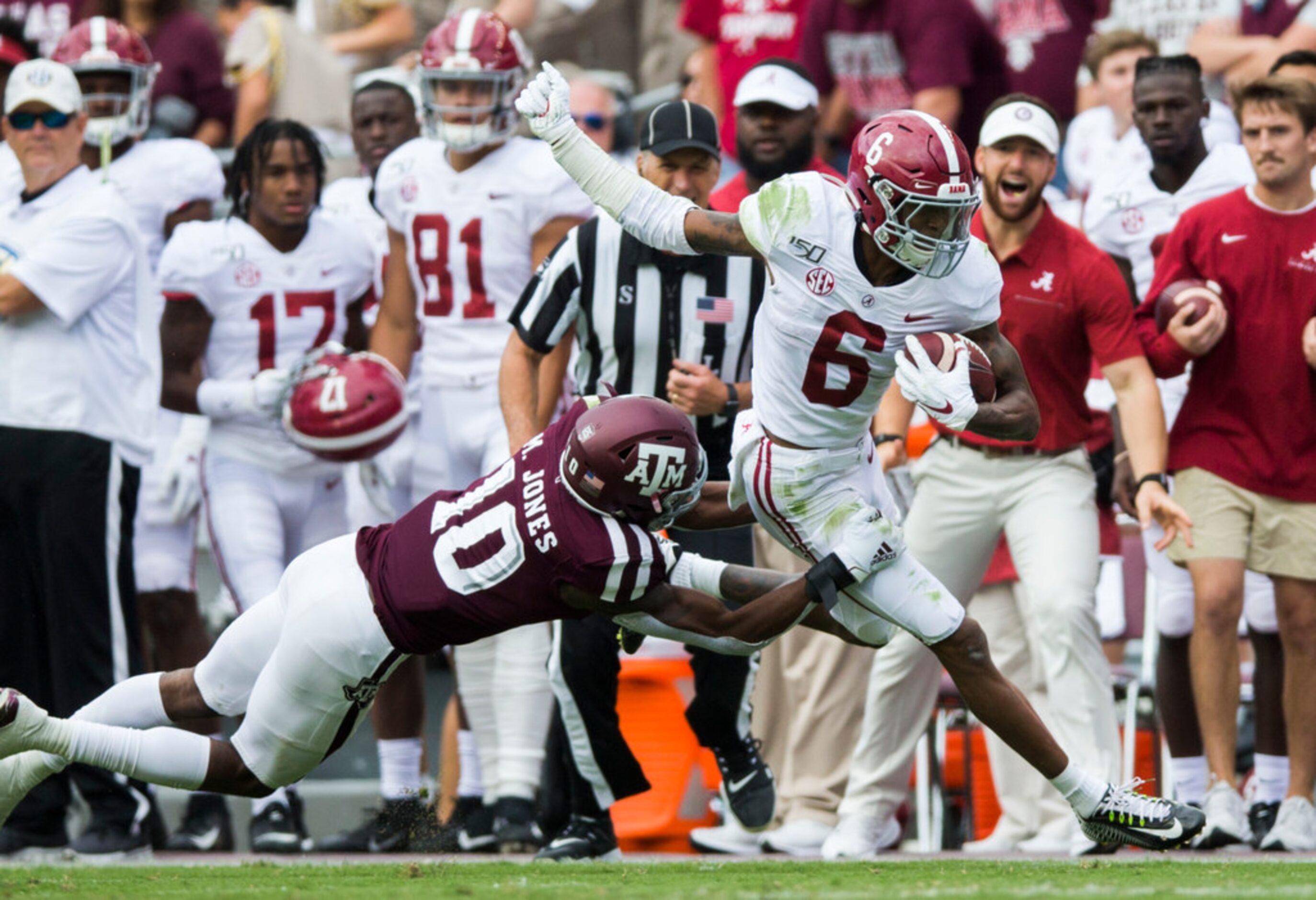 Texas A&M Aggies defensive back Myles Jones (10) tackles Alabama Crimson Tide wide receiver...