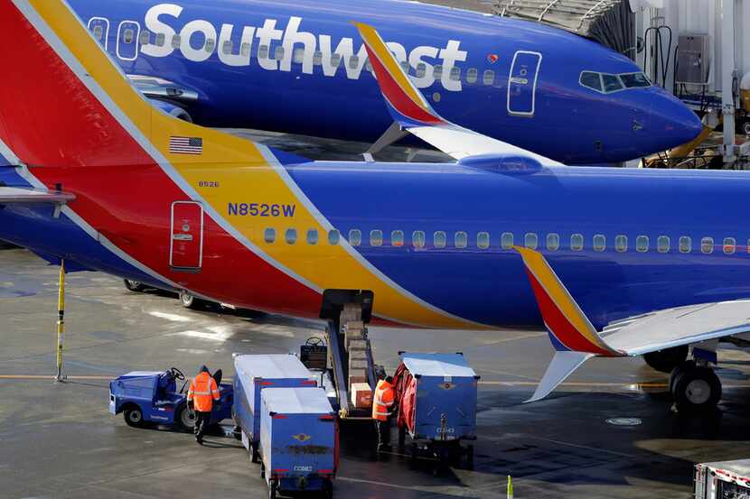 FILE - In this Feb. 5, 2019, file photo, Southwest Airlines planes are loaded at...