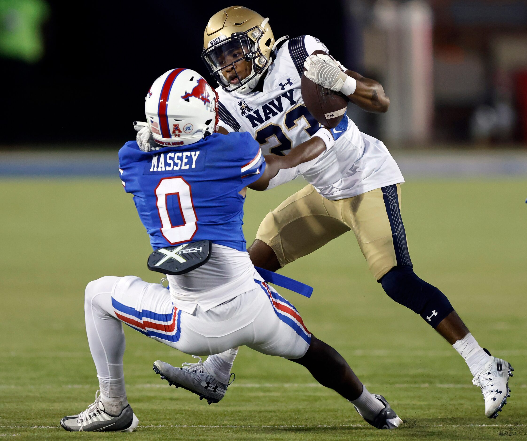 Southern Methodist Mustangs safety Bryan Massey (0) pulls down Navy Midshipmen wide receiver...