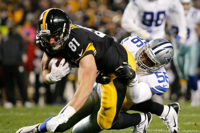 FILE -- Cowboys linebacker Justin Durant (56) tackles Steelers tight end Jesse James (81) in...