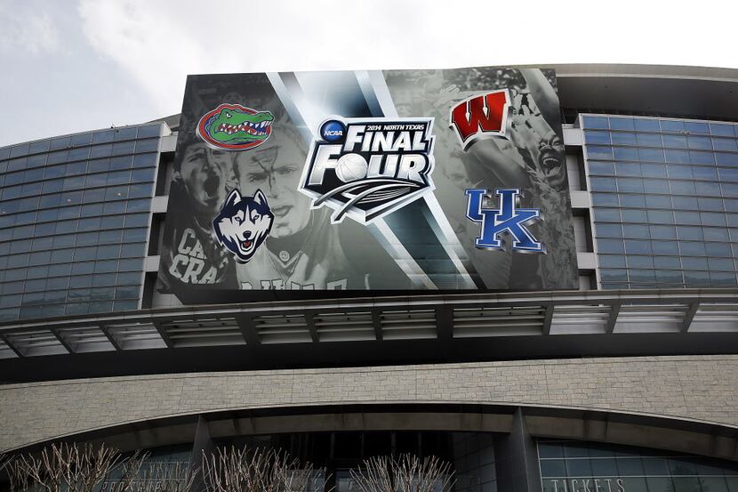 All 2014 NCAA Final Four teams are represented above the main entrance to AT&T Stadium in...