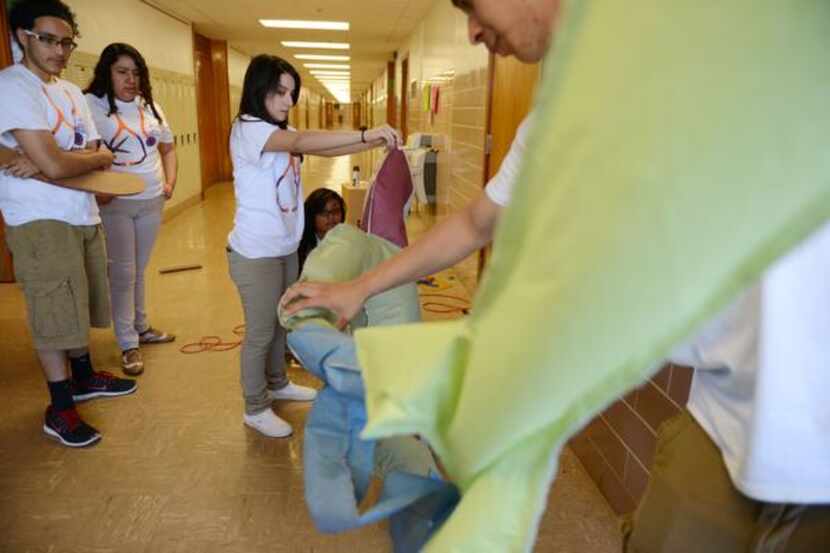 
Students work on their Destination Imagination team's anti-smoking campaign at Bryan Adams...