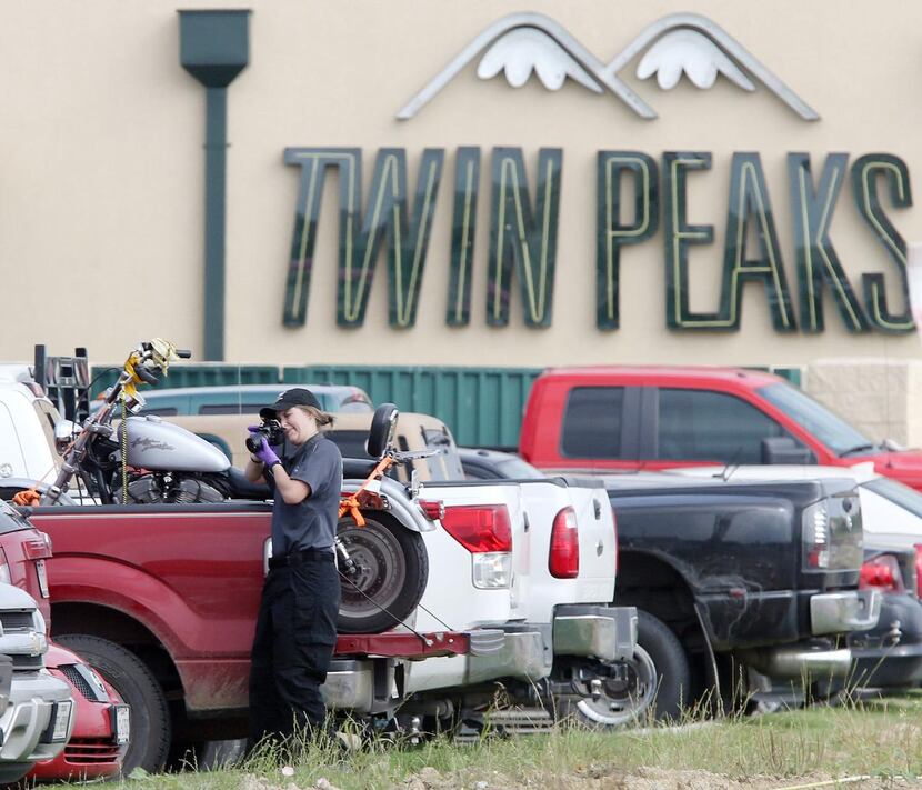A law enforcement officer  photographed a vehicle in the parking lot of Twin Peaks in Waco...