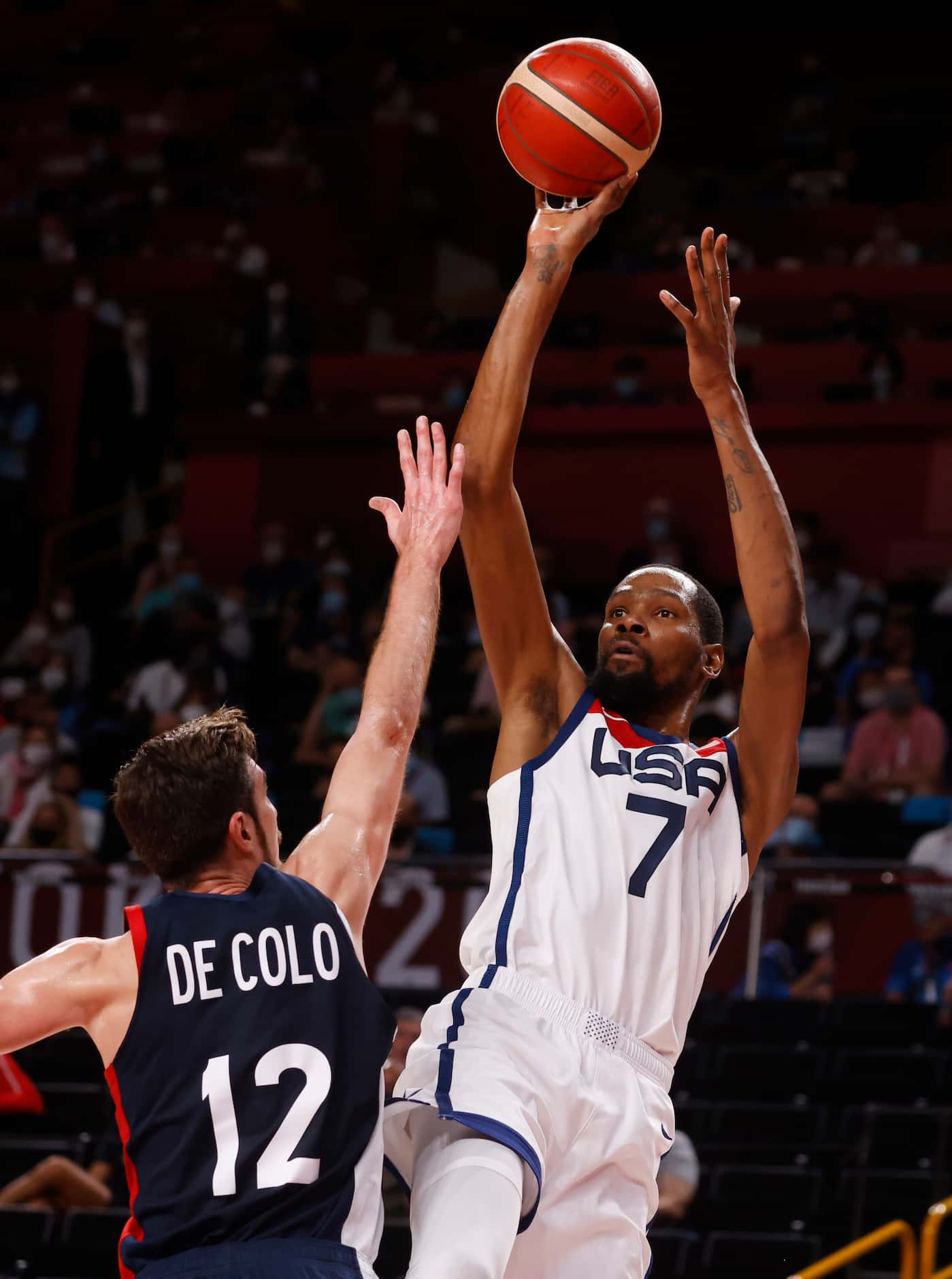 USA’s Kevin Durant (7) attempts a shot in front of France’s Nando de Colo (12) during the...