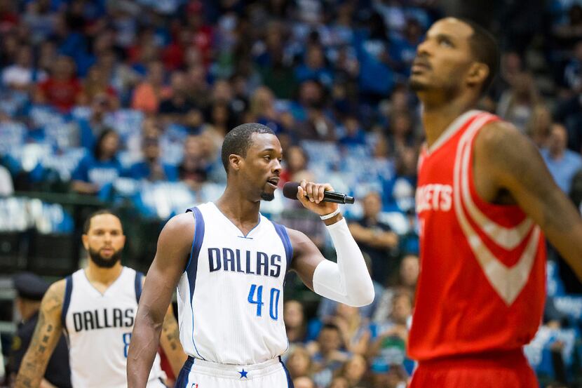 Dallas Mavericks forward Harrison Barnes addresses the crowd before an NBA basketball game...