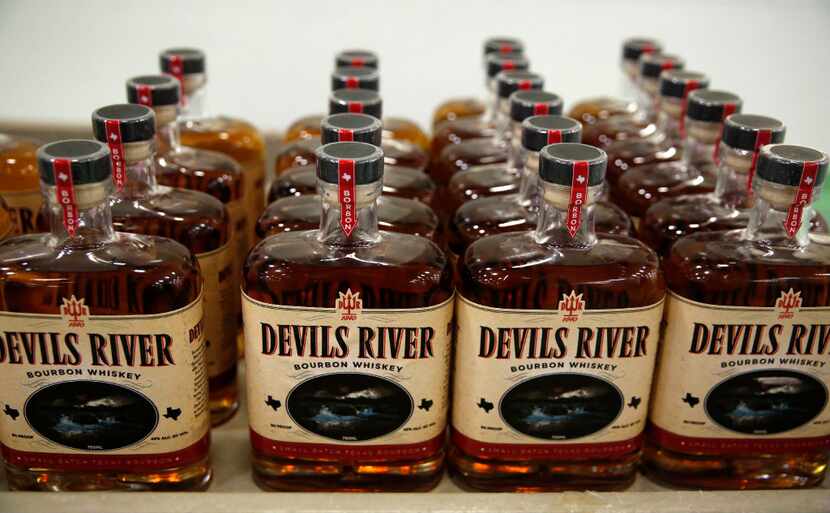 Devils River Whiskey bottles on a cart after being bottled at  a facility in Dallas on...
