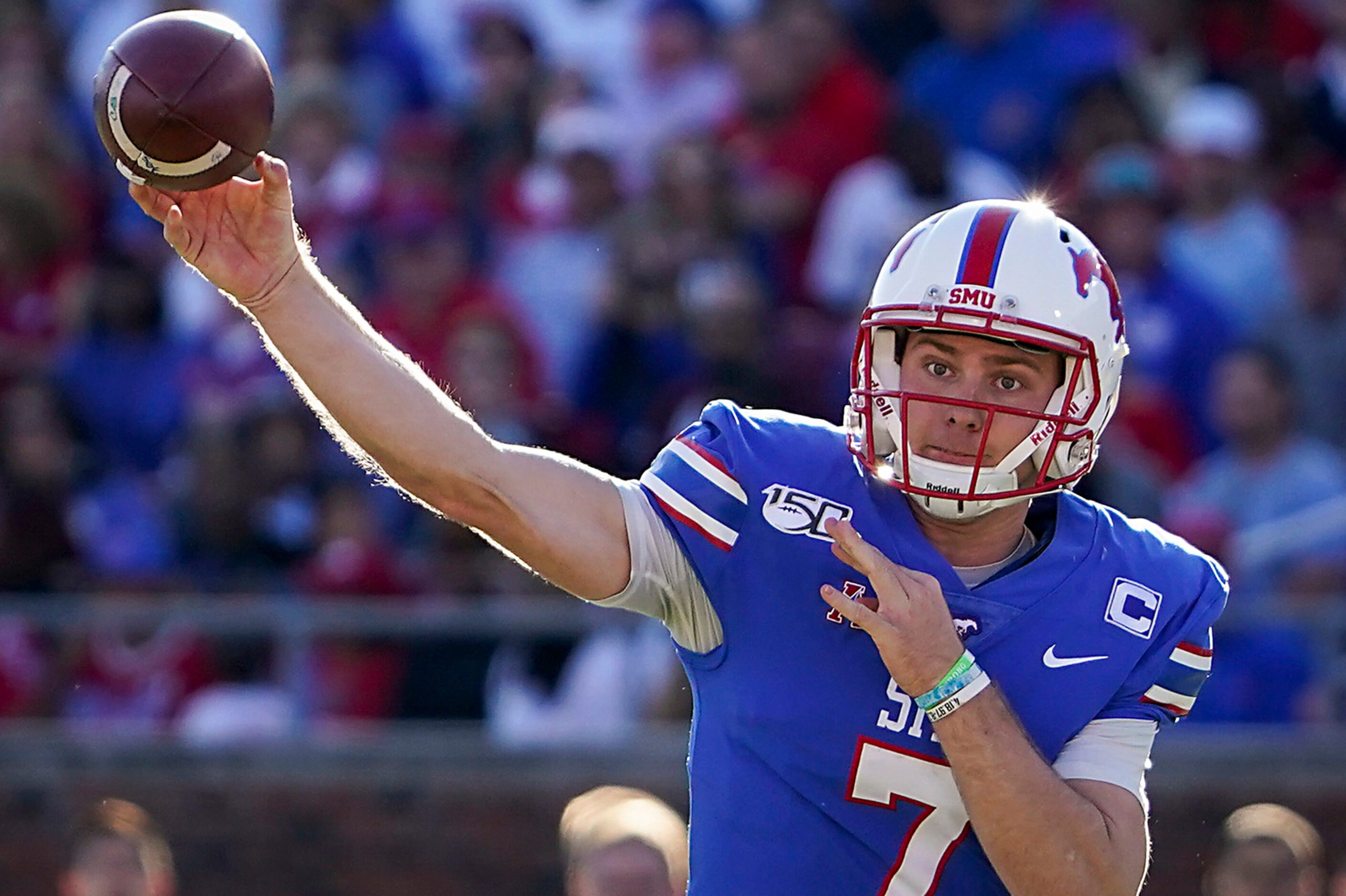 SMU quarterback Shane Buechele (7) throws a pass during the first half of an NCAA football...