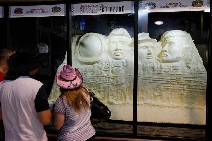 People look at a butter sculpture at the State Fair of Texas in Dallas on Sunday, October 1,...