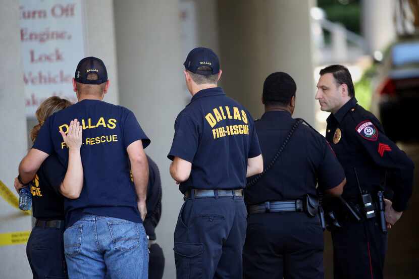 Authorities react outside of the Baylor University Medical Center at Dallas emergency room...