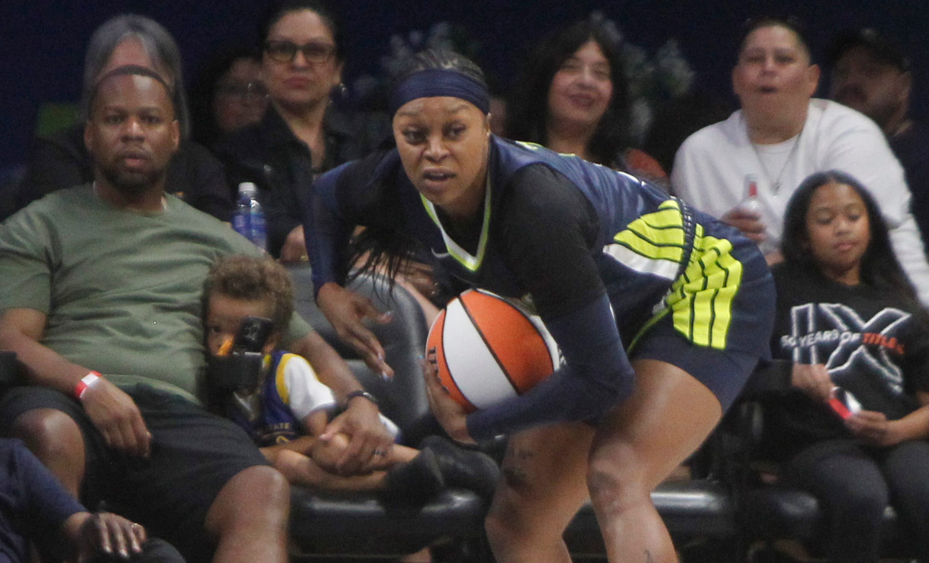 Dallas Wings guard Odyssey Sims (2) pulls down a defensive rebound during 2nd quarter action...