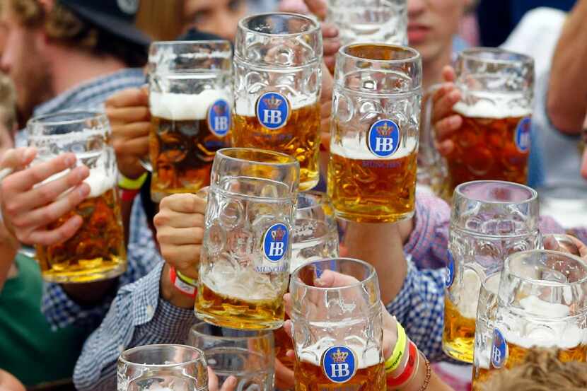 People celebrate the opening of the Oktoberfest beer festival in Munich, Germany.