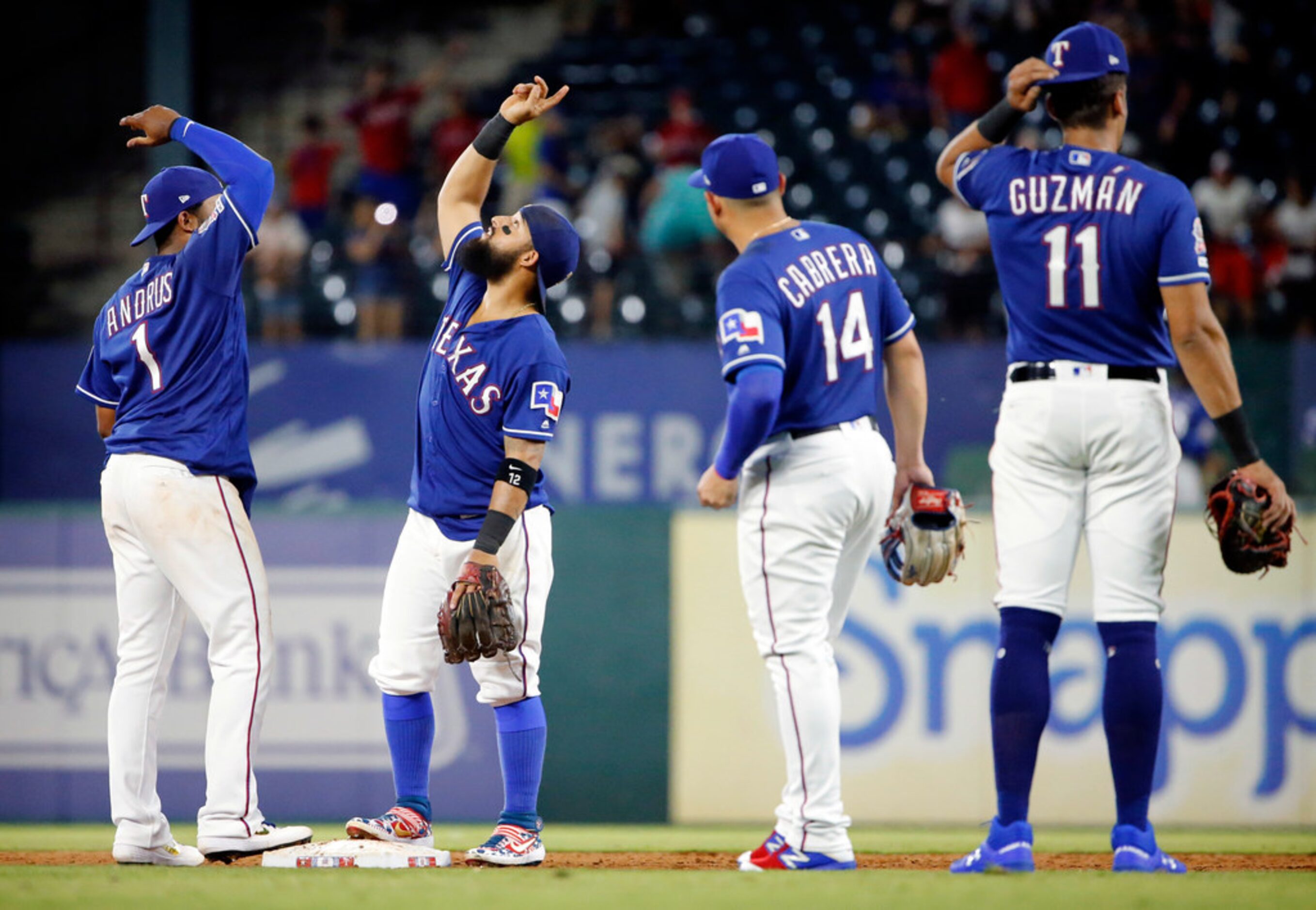 Texas Rangers shortstop Elvis Andrus (1) and second baseman Rougned Odor celebrate their win...