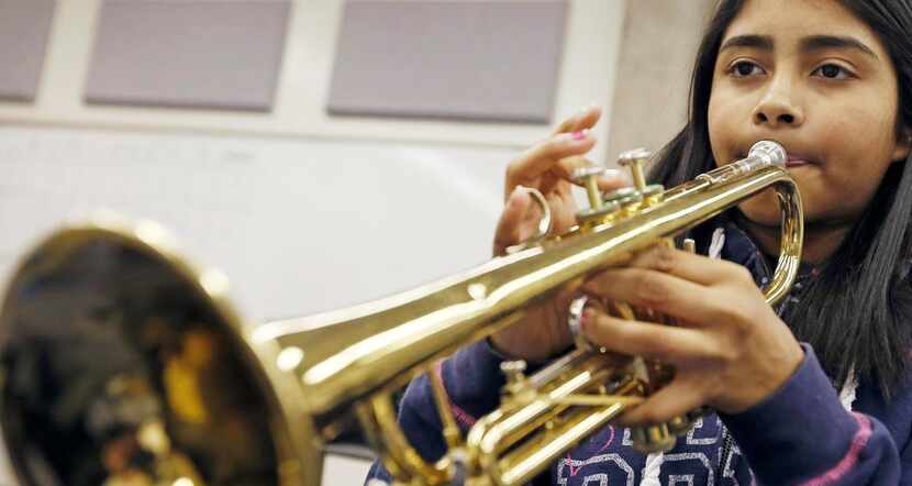 
Mariah Galarza, 12, practices during a music class instructed by Jones. So far, two...