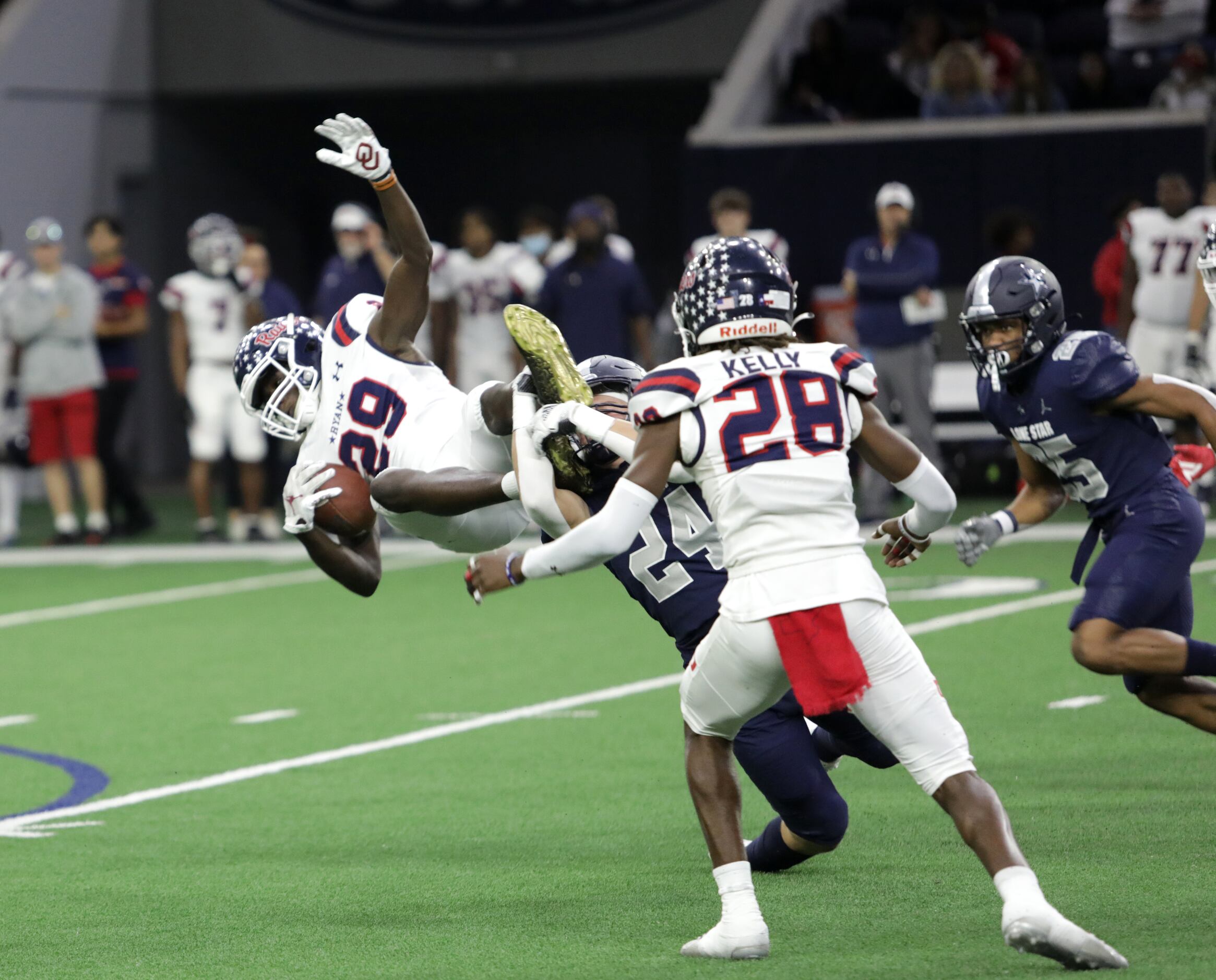 Ryan player #29, Chance Rucker, leaps past Lone Star player #24, Johnny Yanez, during the...