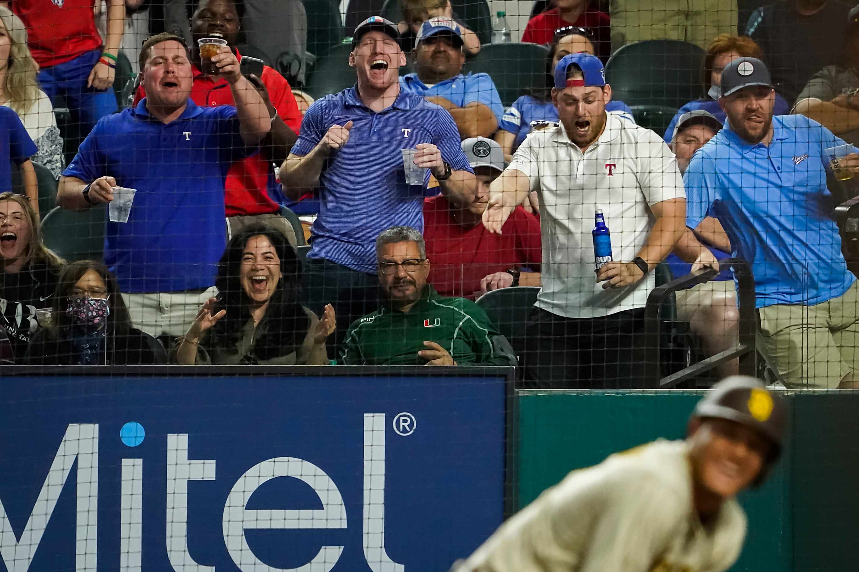 Texas Rangers fans heckle San Diego Padres third baseman Manny Machado after he struck out...