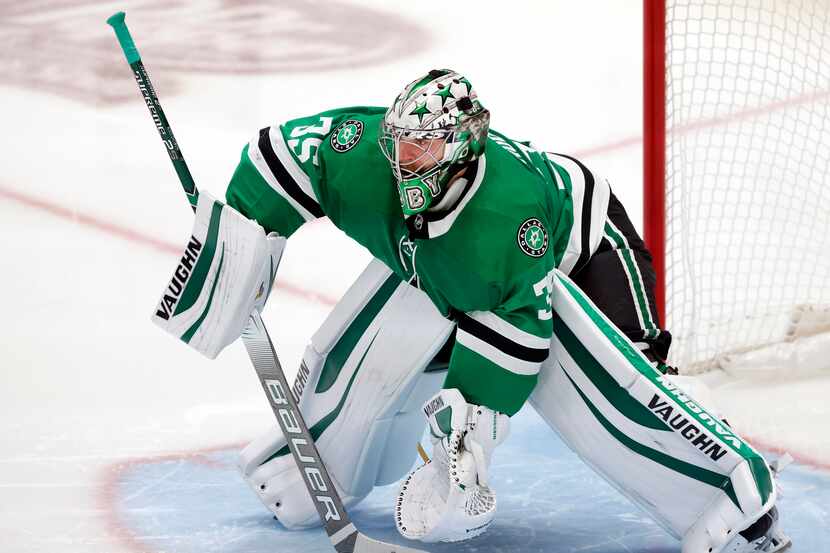 Dallas Stars goaltender Anton Khudobin (35) deflects a loosely shot puck by the Columbus...