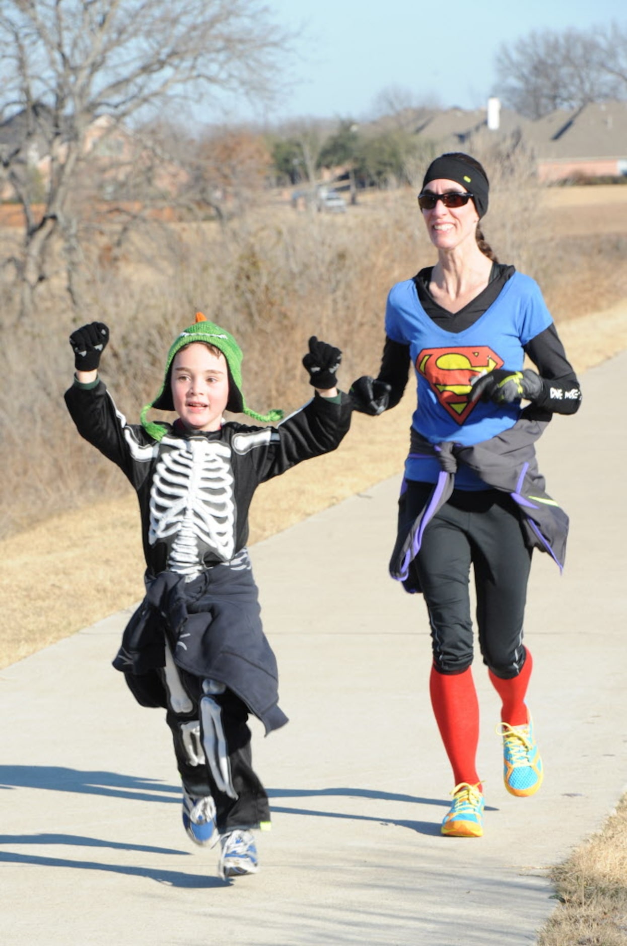 Super Mom and Skeleton Boy Dana and Levi Chatham celebrate their big finish in the Superman...